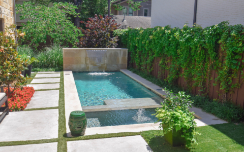 Backyard swimming pool with water feature- Pulliam Pools